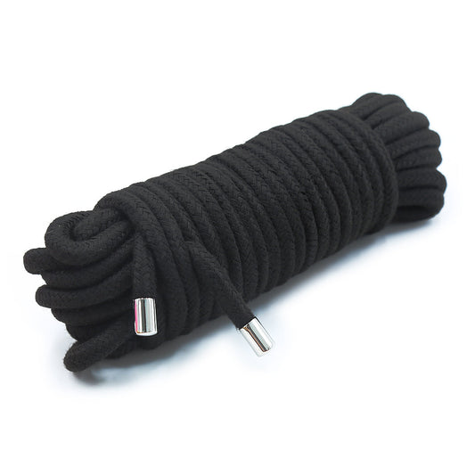 Black bondage rope with soft cotton and metal tips.