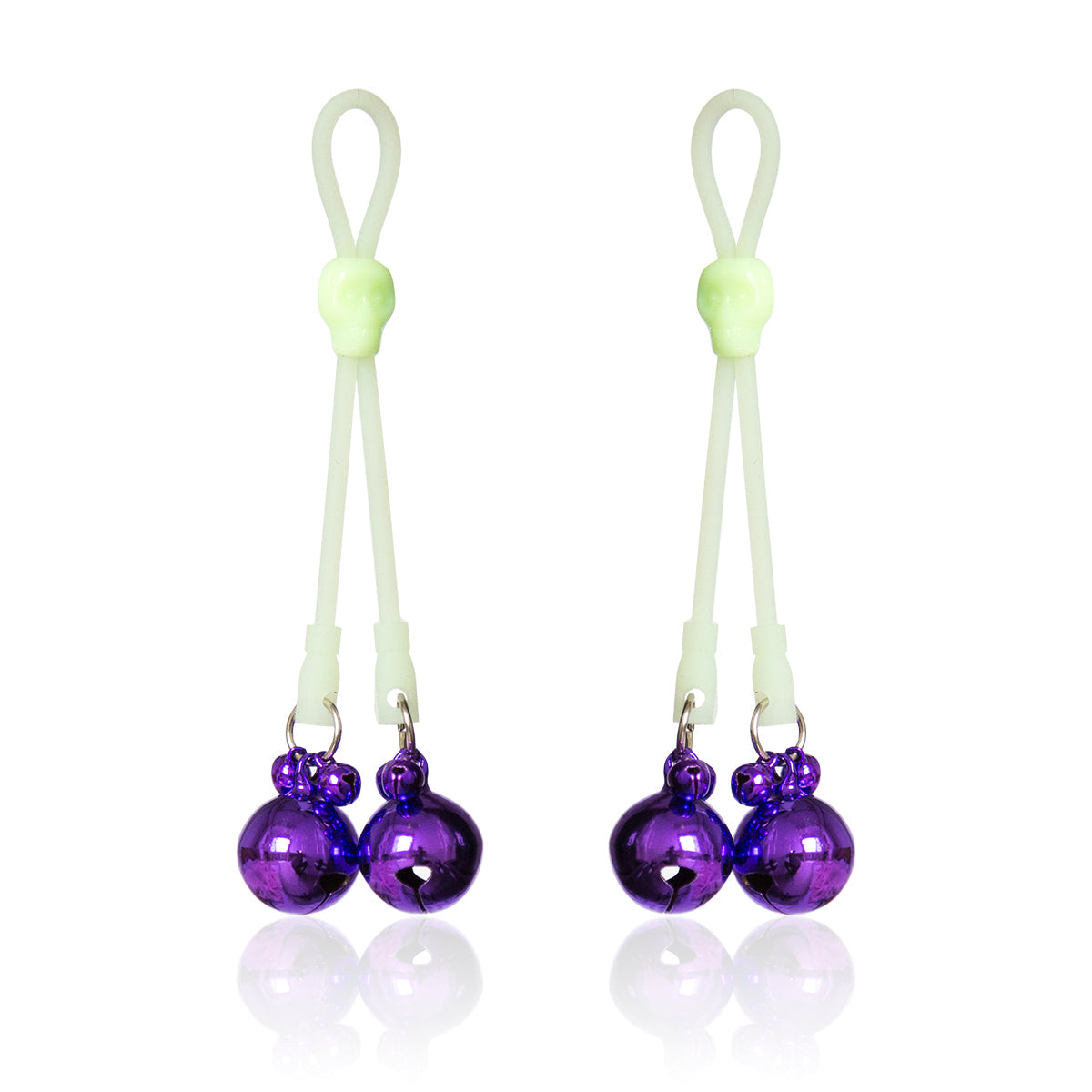 Glow-in-the-dark adjustable nipple bells with purple jingle bells and skull accent.