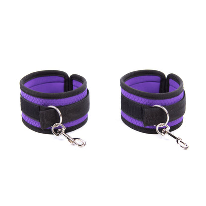 bed restraint system with padded cuffs and blindfold in purple