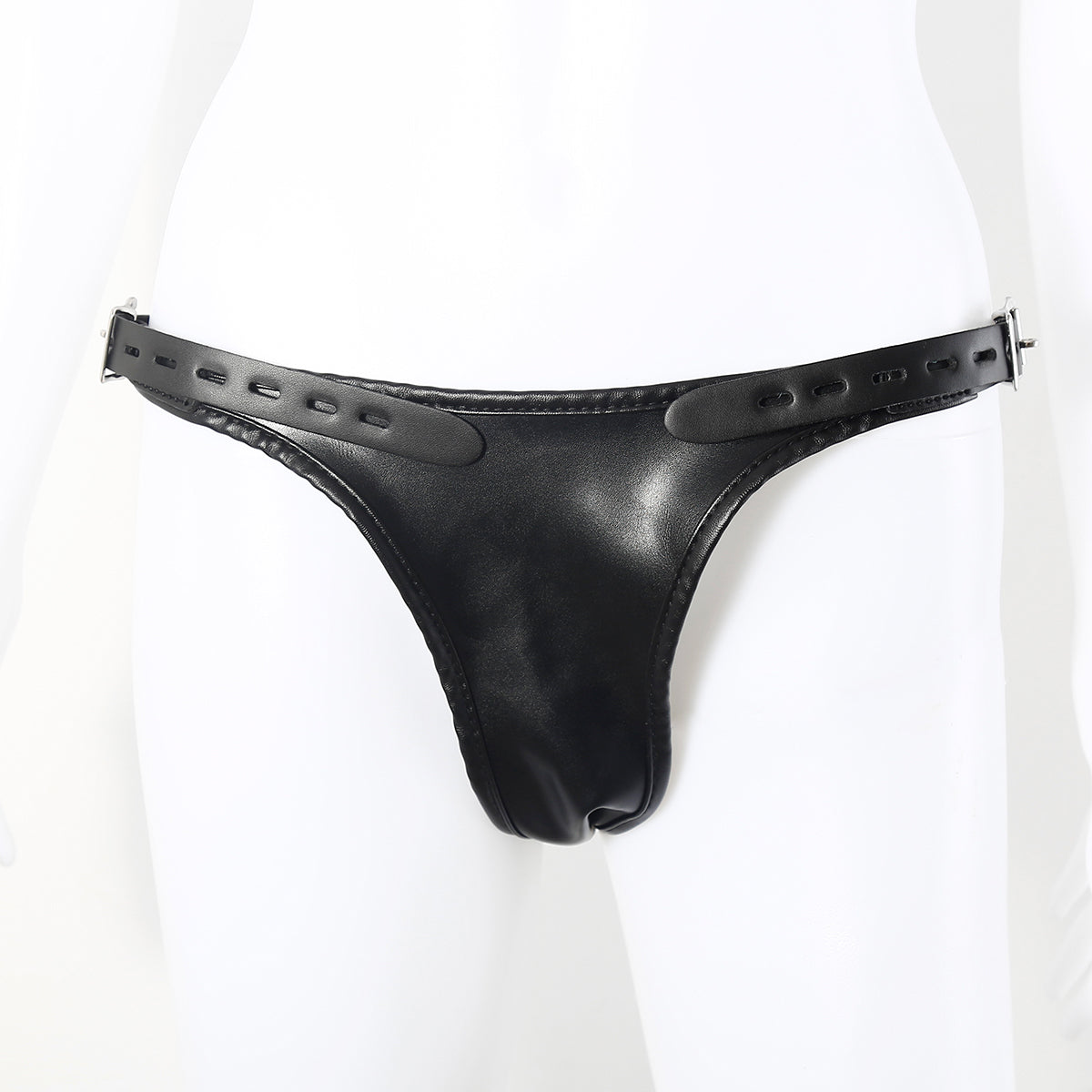 Model wearing black faux leather double penetration strap-on harness on a white background. 