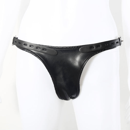 Model wearing black faux leather double penetration strap-on harness on a white background. 