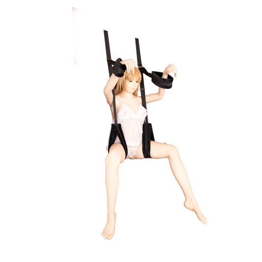Woman in lingerie using black door sex swing with padded straps.