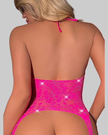 Back view of model wearing pink lace and fishnet strappy bodystocking with halter neckline.