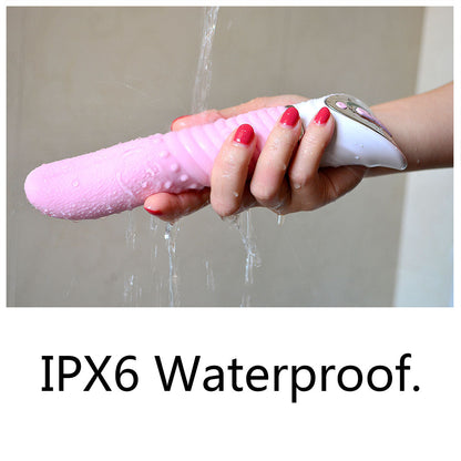 Hand holding a pink vibrator under running water with 'IPX6 Waterproof' text.