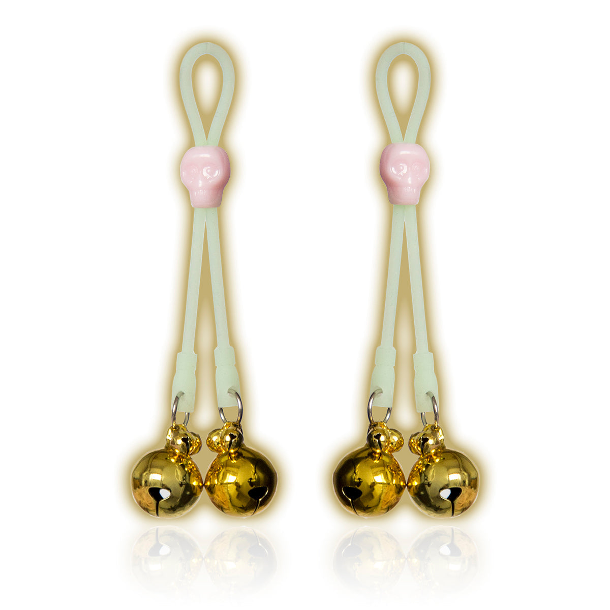 Glow-in-the-dark adjustable nipple bells with gold jingle bells and skull accent.