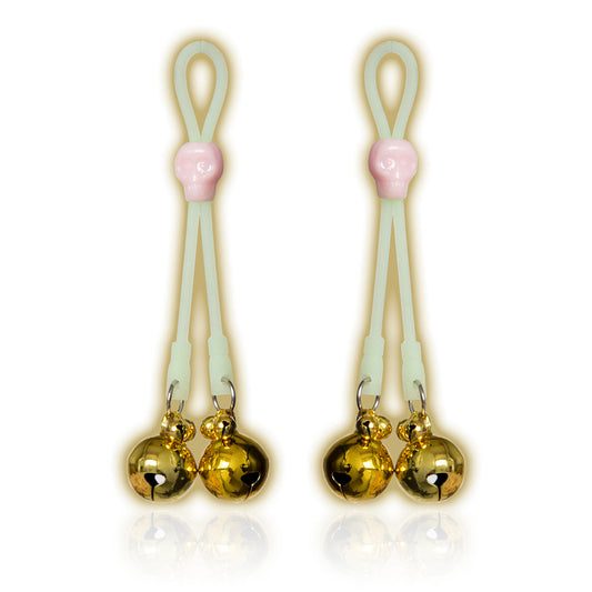 Glow-in-the-dark adjustable nipple bells with gold jingle bells and skull accent.