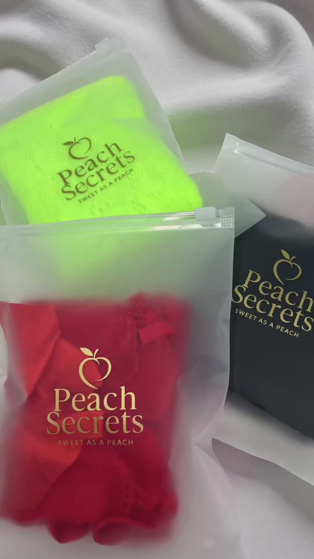 Load video: Peach Secrets lingerie packaged in frosted, logo-printed bags.