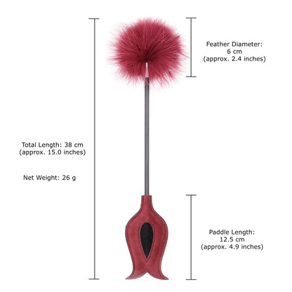 Red feather tickler with faux suede spanking paddle and with measurement. 