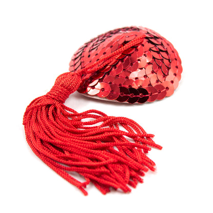 Red sequin nipple pastie with dangling tassels.